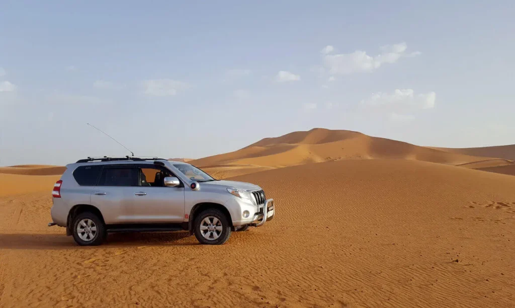 Enjoy a Toyota TX ride in the middle of the Sahara Dune sof Morocco