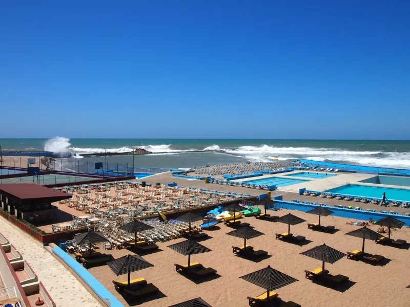 Overhead perspective of the beach and pool area from a high building, capturing the essence of Casablanca's attractions.